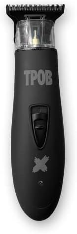 A barber detailing a beard line using the zero gapped professional trimmer.