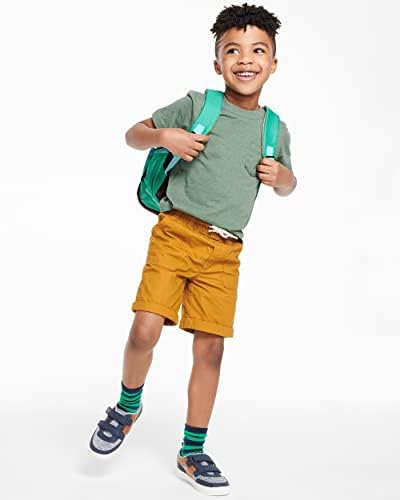 Child wearing Skip Hop Pug backpack for scale