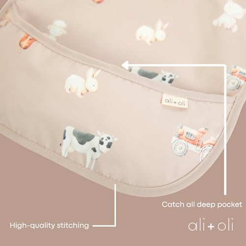 Folded Ali+Oli smock bib for travel storage
