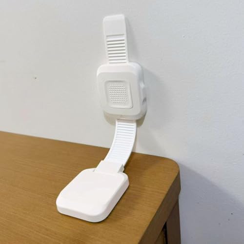 TIPNOT anti tip furniture wall straps securing a tall wooden dresser to a modern living room wall