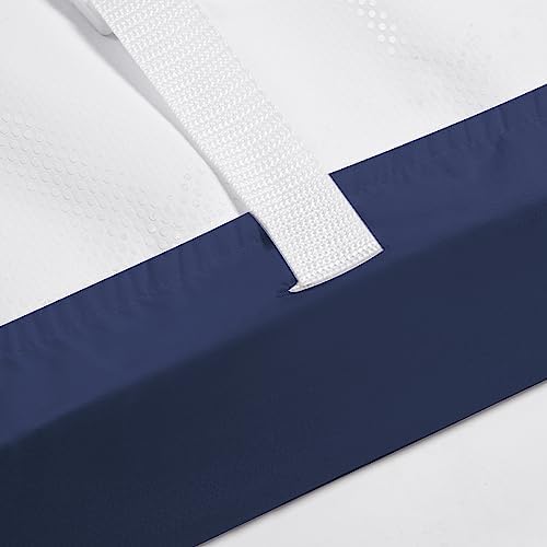 PHF changing table sheet securely fitted on a standard contoured diaper changing mattress.