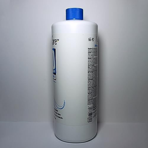 Group of hair styling tools with Salon Care clear developer bottle