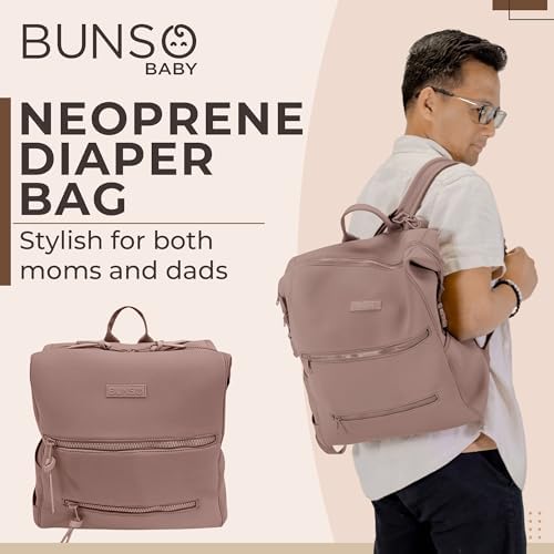 Bunso Baby water resistant diaper bag attached to a stroller using the integrated straps