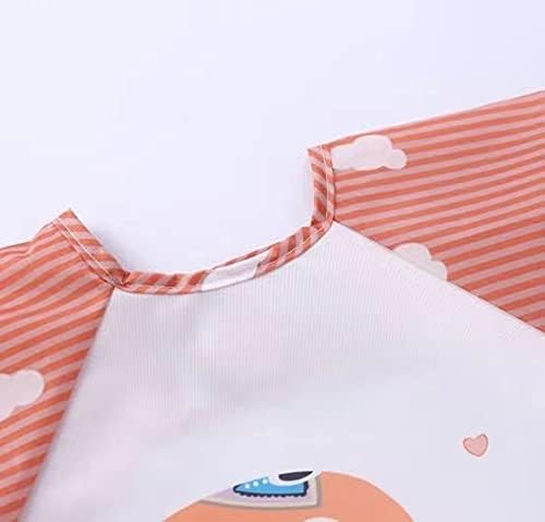 Water-resistant test showing liquid safely rolling off the surface of the polyester smock bib