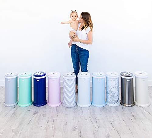 Ubbi diaper pail placed in a modern nursery setting