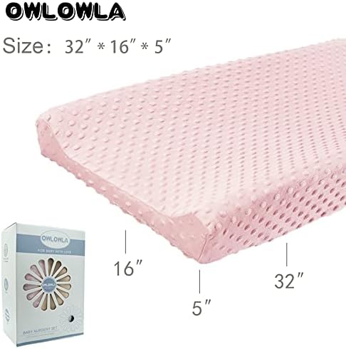 Owlowla changing pad cover highlighting the safety strap slots