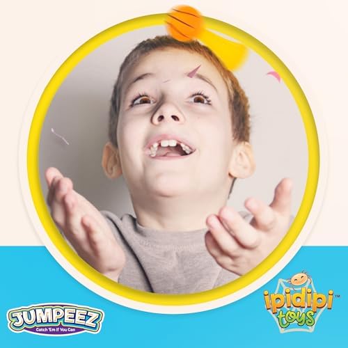 A mini rubber sports ball launcher popping high into the air during active outdoor play