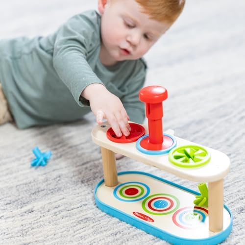 Melissa and Doug Match and Push Spinning Tops packaging and product components
