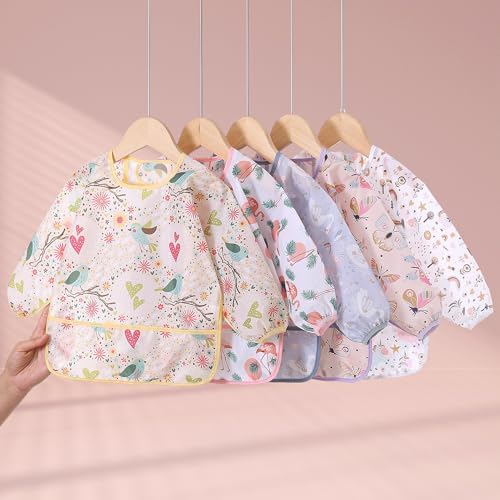 Back perspective of the full coverage toddler weaning bib showcasing the secure fit and comfortable arm movement.