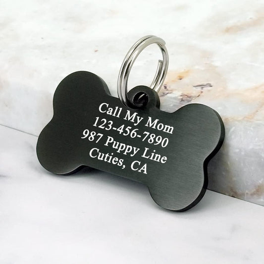 Durable dual sided engraved pet name tag attached to a large dog collar.