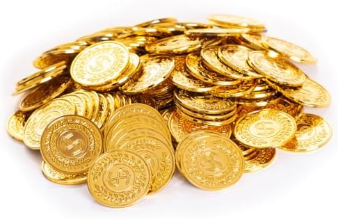 Assorted gold play coins piled up inside a small treasure chest prop