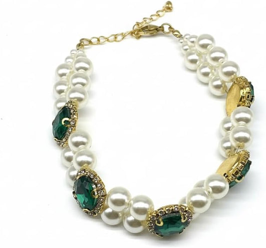 Hotlion adjustable pearl dog collar with rhinestone setting worn by a small white puppy.