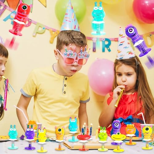 Group of authentic imported monster jumping prizes scattered across a school classroom reward table setup.