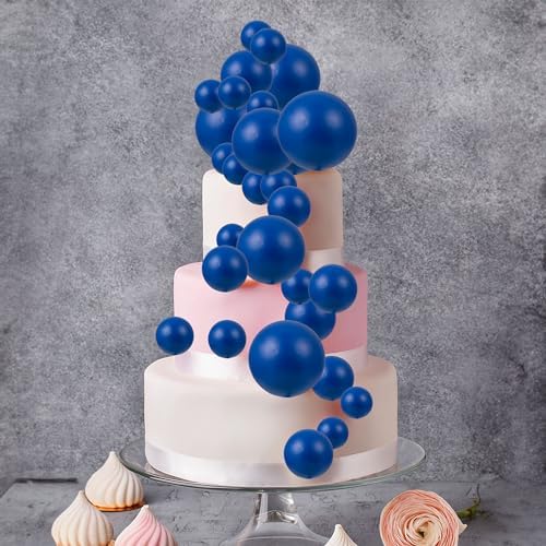 Modern royal blue cake topper decorations on a dessert