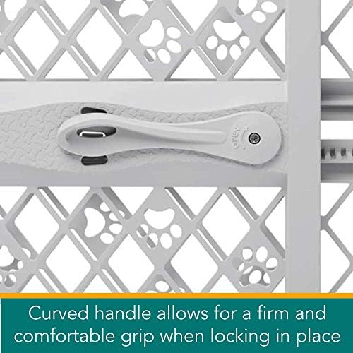 Durable plastic dog gate expanding along the EZ track mechanism showing paw print designs.