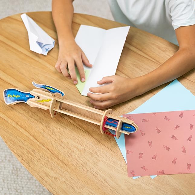 Fat Brain Toys Sky Surfer aerodynamic testing toy with paper plane on launcher.