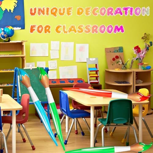 Inflated giant paintbrushes packed together demonstrating vibrant red green blue and yellow color choices for celebrations.