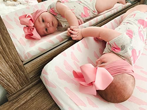 BaeBae Goods premium baby girl changing pad cover set installed on a standard contoured nursery mat