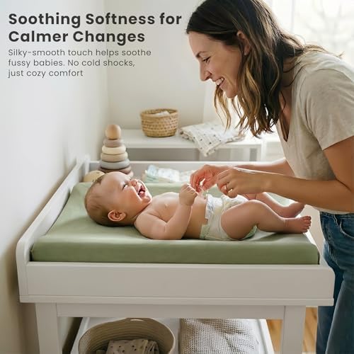 Konssy gender neutral changing table sheets installed inside a modern nursery room
