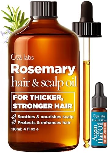 Amber glass dropper bottle of Gya Labs rosemary hair oil for scalp hydration.