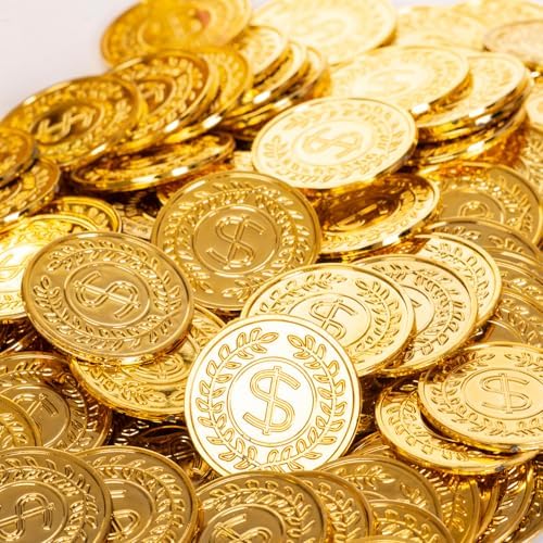 Bulk set of 120 pieces gold pirate tokens scattered on a wooden table
