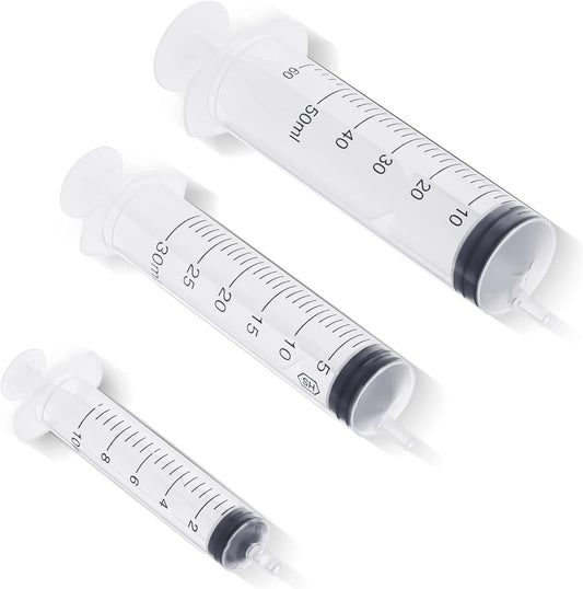 Three red rubber 8 French animal feeding tubes alongside blue bulb syringe