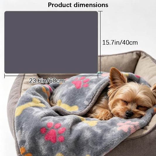 Soft flannel dog and cat throw blanket spread out on a sofa