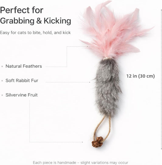 Three vibrant carrot cat toys with natural feathers