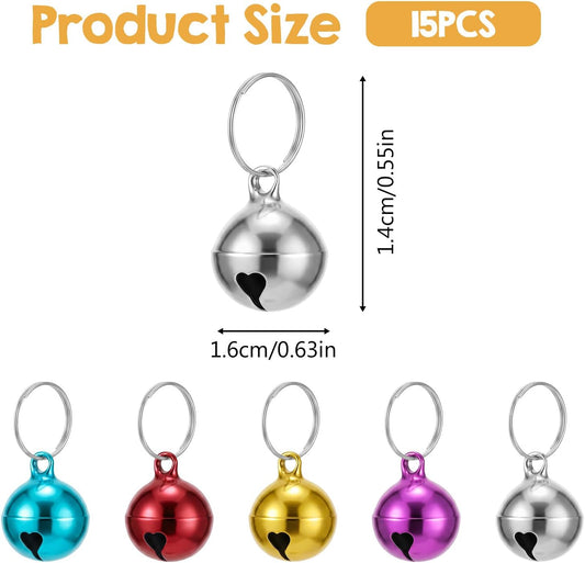 Close up of half inch mini dog collar jingle bells with heart shaped cutout details.