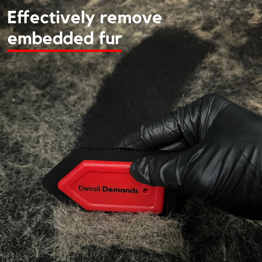 Close up of red rubber edges on Detail Demands pet hair tool
