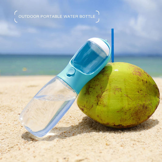 Leak proof pet water dispenser being used to give clean water to a puppy during an outdoor hike.
