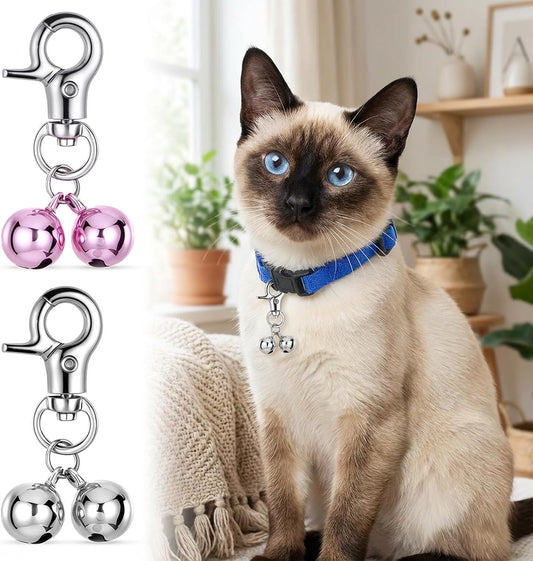 Close up view of the loud stainless steel dog bell with heavy duty snap clip.
