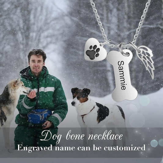 Close up of personalized dog bone charm showing detailed paw print accent.