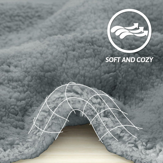 Furrybaby sherpa dog blanket shielding a living room couch from pet hair