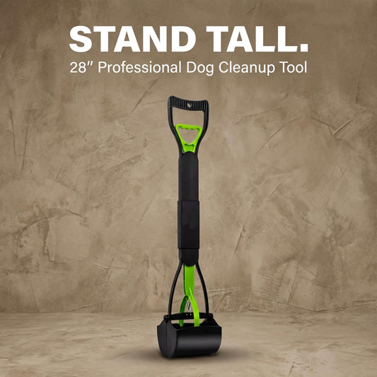 Long handle pet waste picker deployed for upright backyard cleanup.