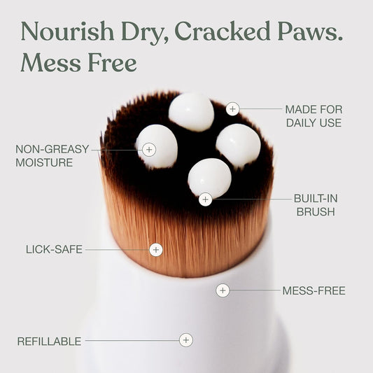 Dandylion dog paw lotion being applied to dry cracked dog paw pads with the mess-free brush