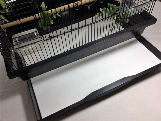 Close up of moisture-resistant poly-coated surface on bird cage liner