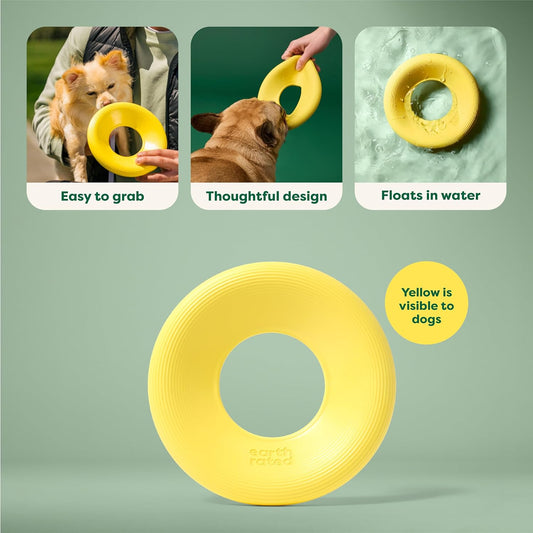 Small dog playing with yellow Earth Rated flying disc