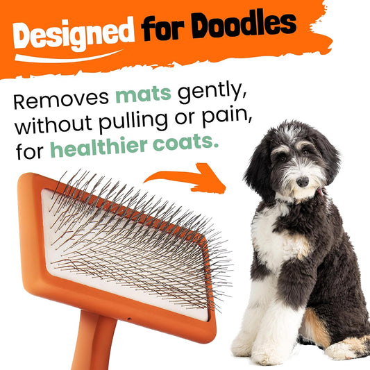 Orange curved doodle brush showing long angled stainless steel pins