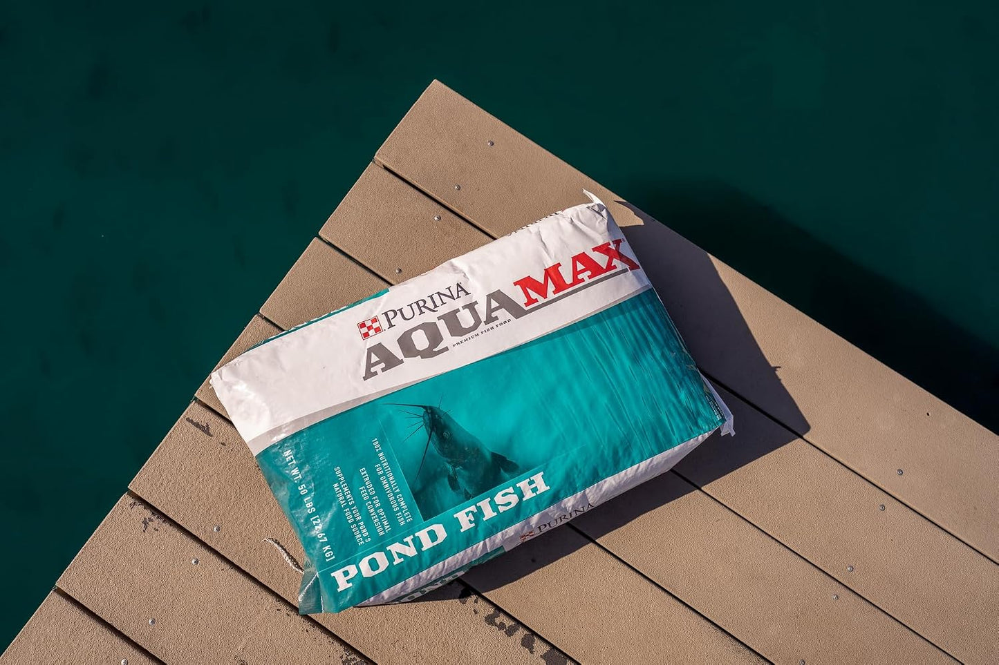 Purina AquaMax floating fish food pellets close up