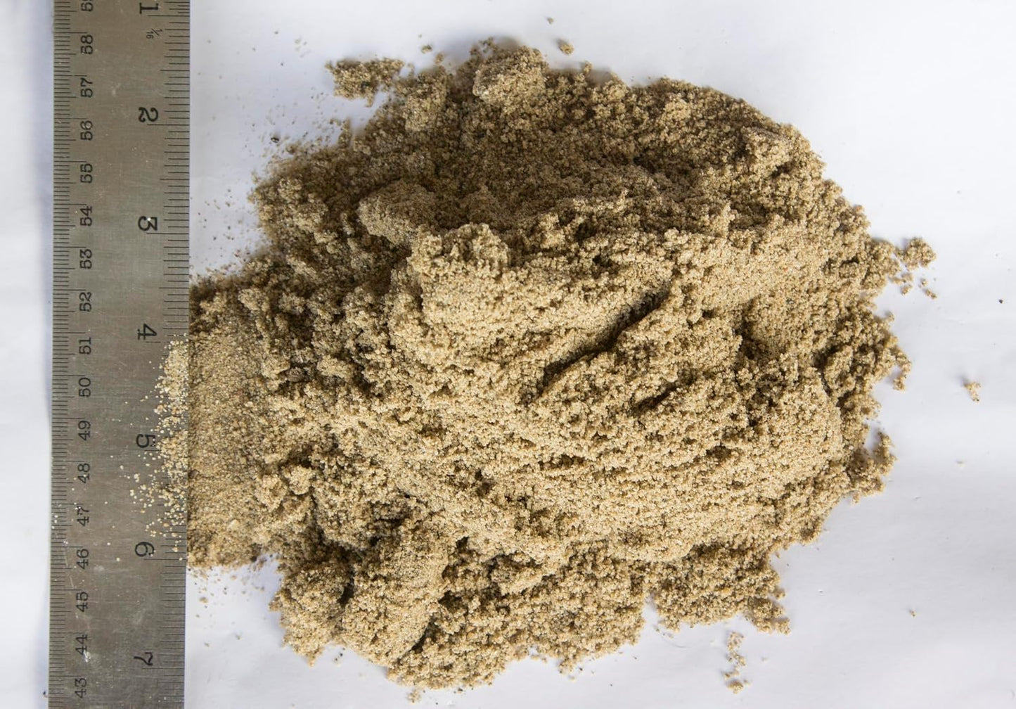 Professional masonry tools with Dominator sand for mortar mixing