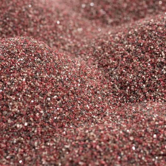 Close up texture of Sandtastik brick colored coarse sand