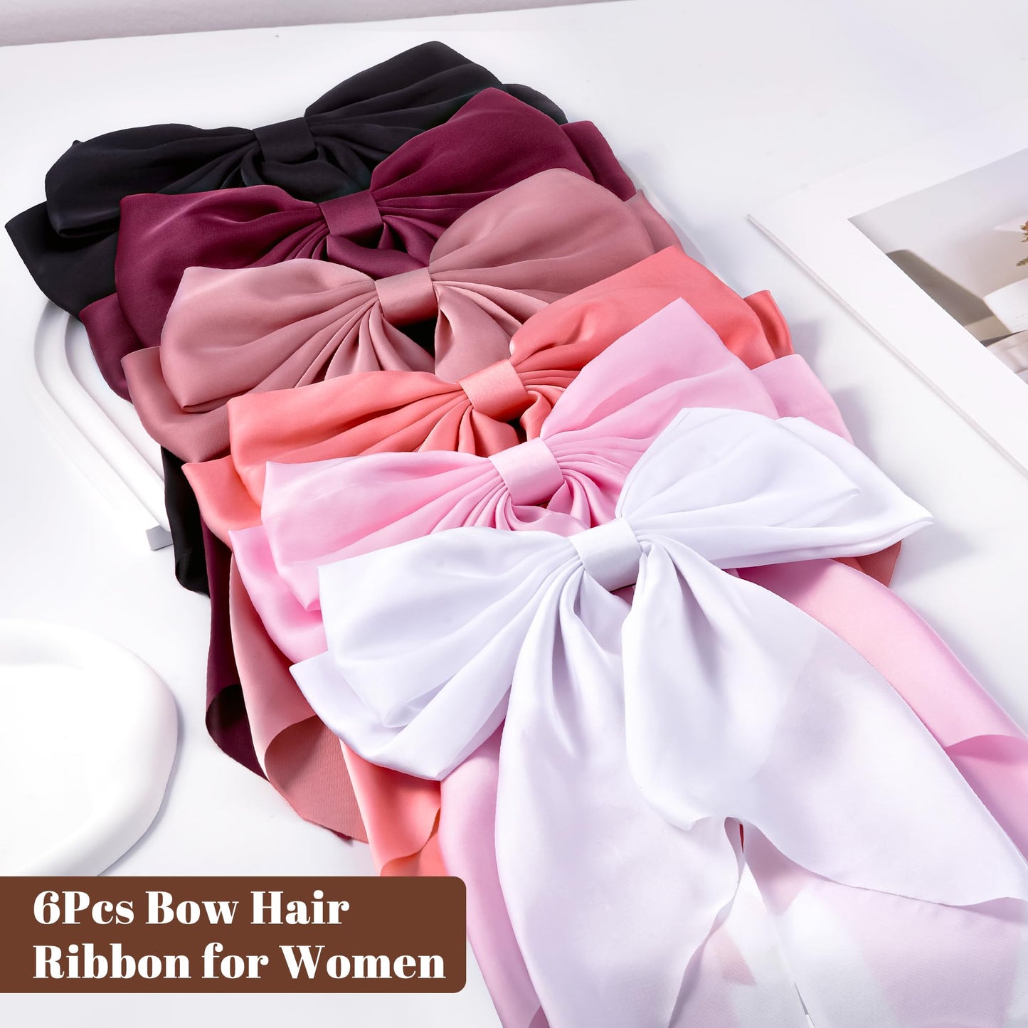 Styling demonstration of large red satin bow clip on hair