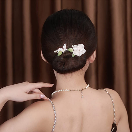 Takeberny flexible hair accessory being rolled up to create a French twist updo