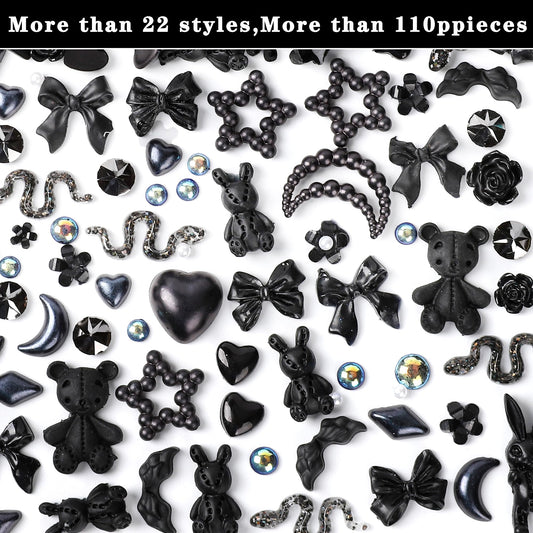Detailed view of black resin flatback camellia rose and bowknot accessories for acrylic manicure decoration