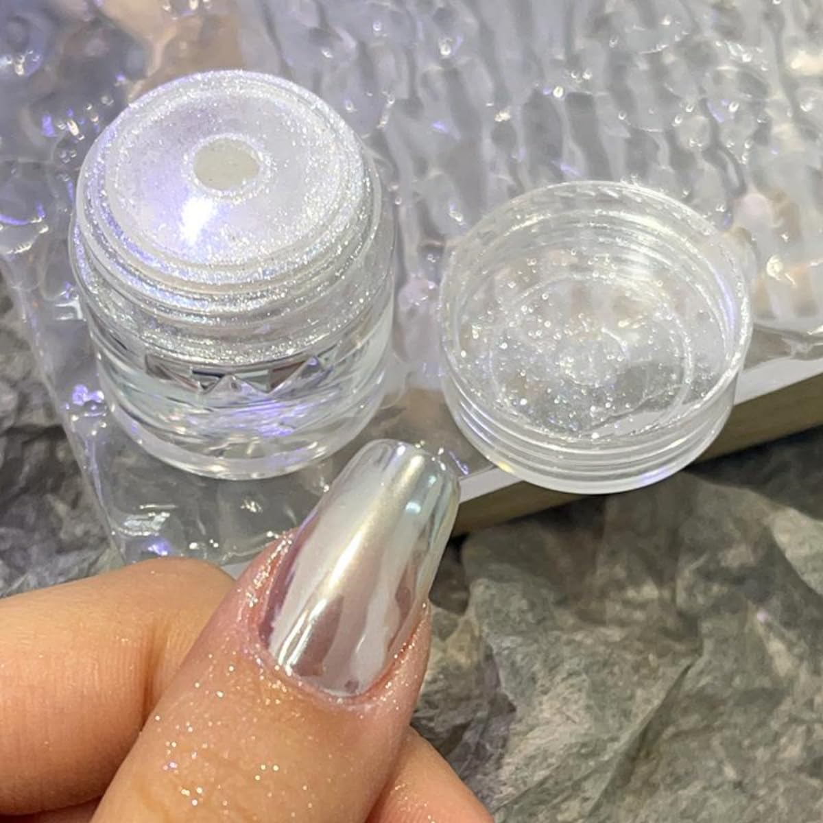 Small jar of Gzmayuen chrome powder held in hand for scale.