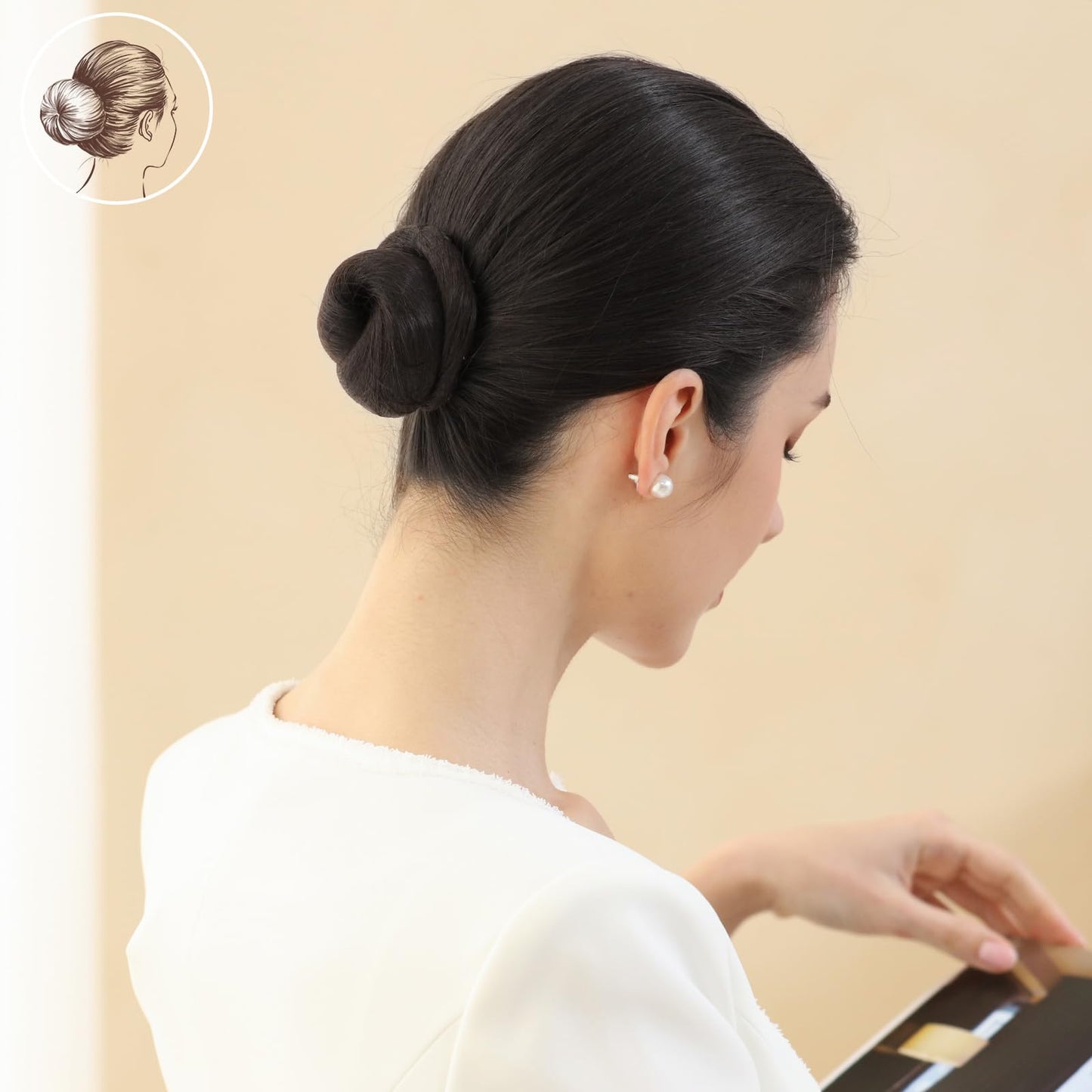 Demonstration of a sleek juda hairstyle created easily using authentic imported spiral pins.