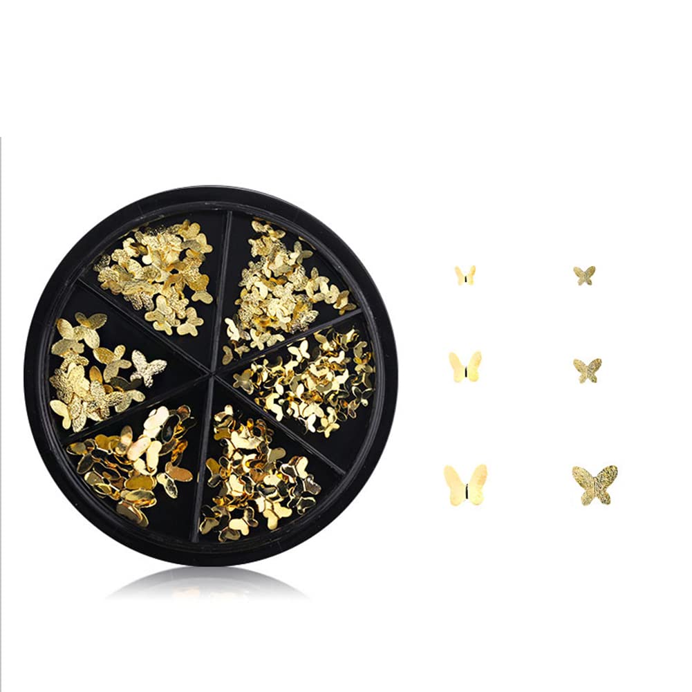 Flat lay of diverse gold butterfly nail jewelry shapes perfect for festive Indian manicure styles.