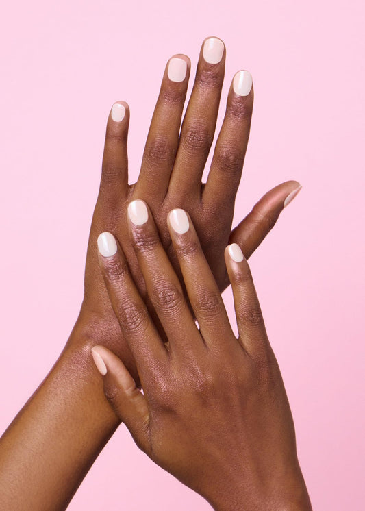 Close up of nude solid color ohora gel nail strips on fingernails