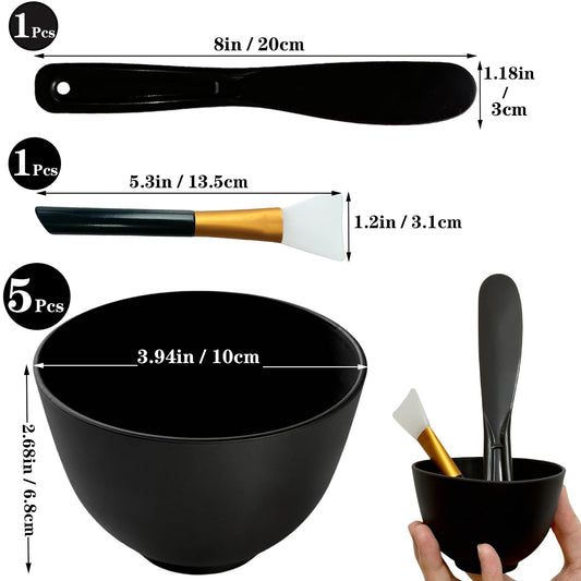 Black silicone face mask mixing bowls displayed with multi-piece applicator accessories for home spa treatments.